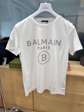 Balmain White Logo Tee with Gold-Accent Shoulder Buttons